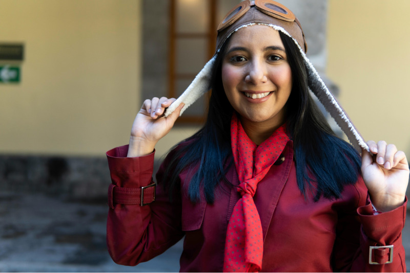 woman student wearing a pilot hat